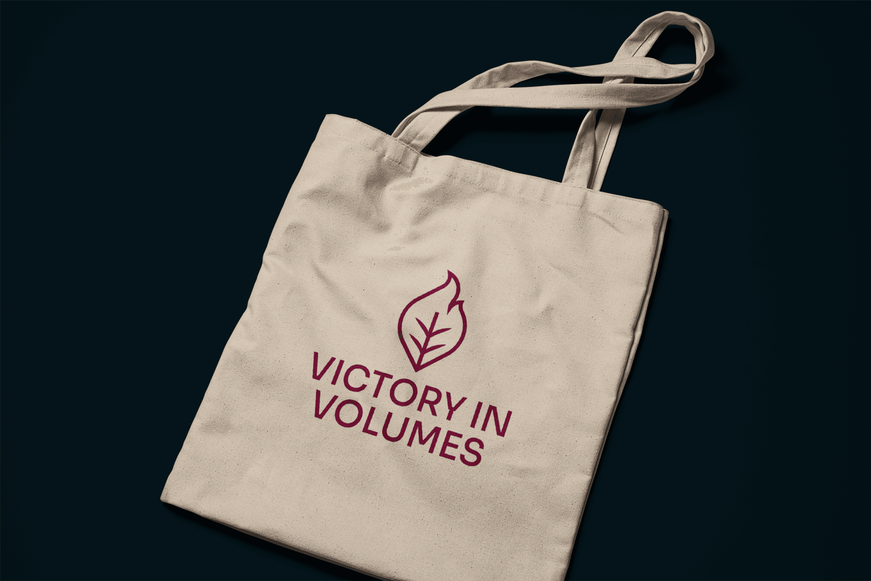 Victory In Volumes brand identity applied to a tote bag